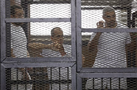 Two of Al Jazeera three are back in prison after three-year sentence for reporting 'false news'